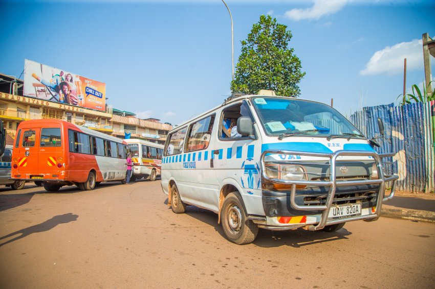 Rental houses and taxis on a busy street in Kampala